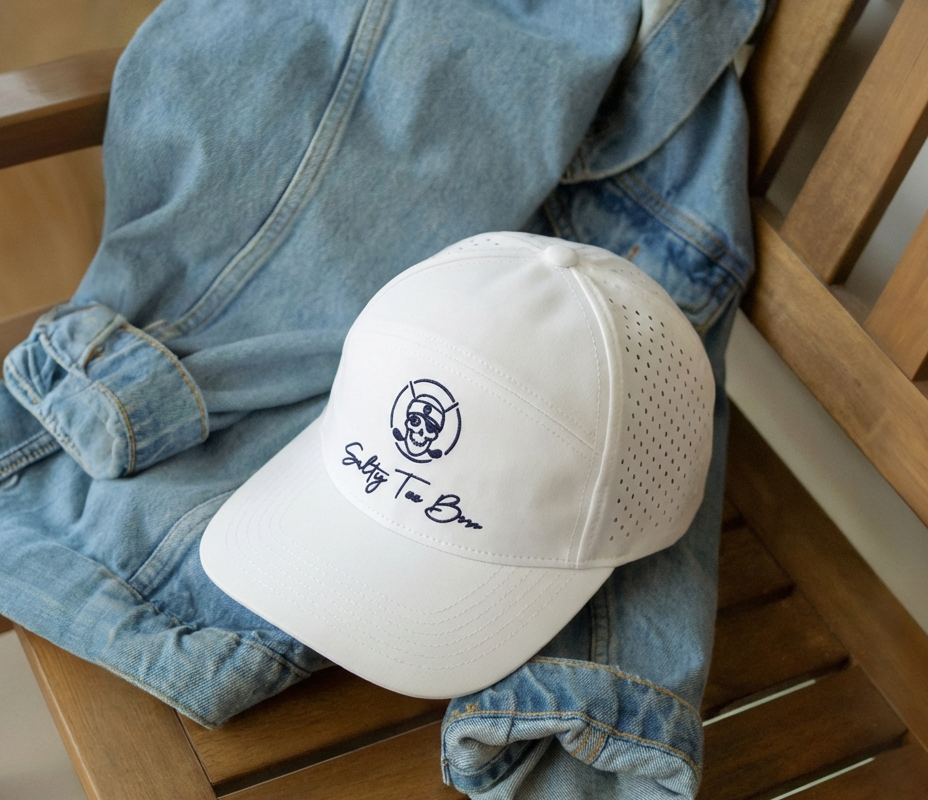 Salty Tee Box White Perforated Cap on denim jacket